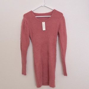 Bright pink sweater dress with puff sleeves from Francesca’s Boutique